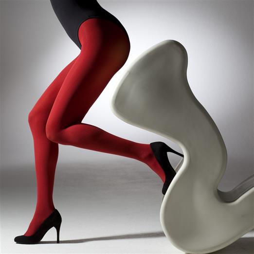 Opaque red tights on a woman's legs, shown from the knees down.  She is wearing black heels.