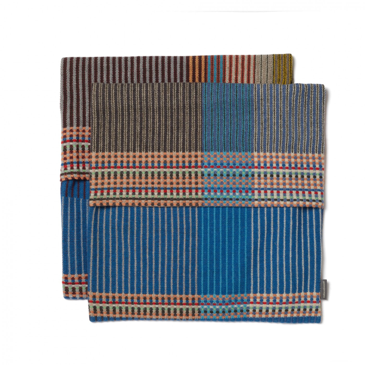 Stack of woven fabric samples with various patterns on a white background