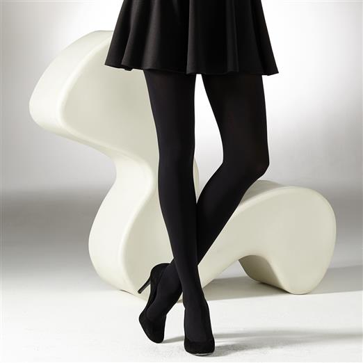 Black opaque tights on a woman's legs, shown from the knees down.  She is wearing black high heels.