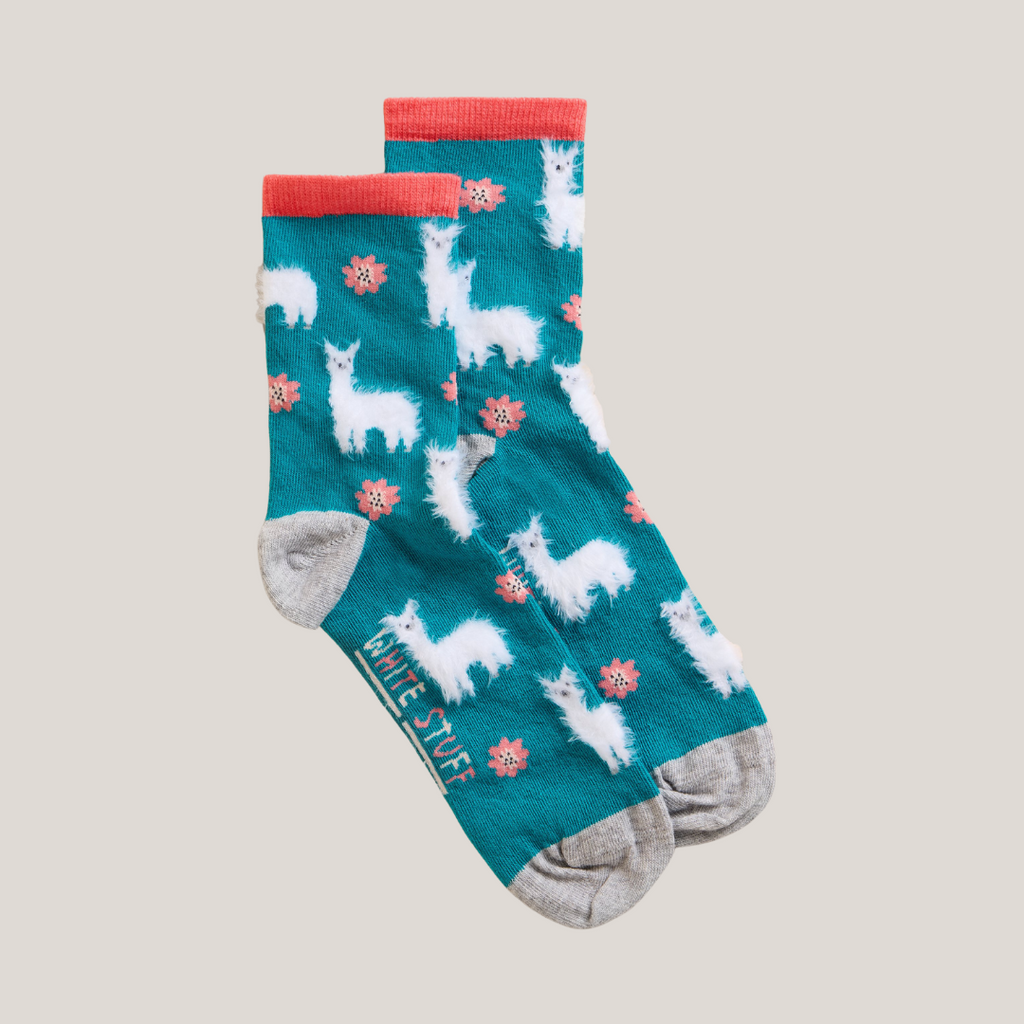 Teal ankle socks with a pattern of white llamas and pink flowers.