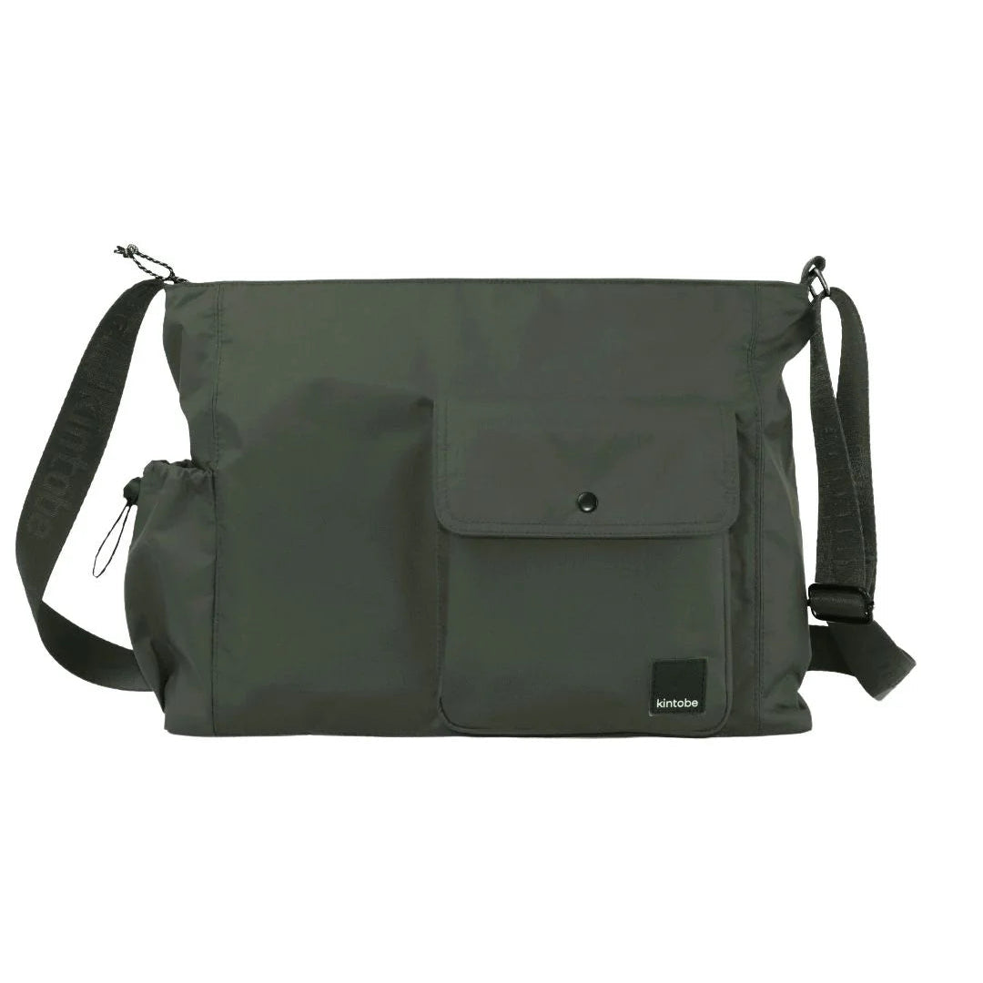 Dark olive green nylon shoulder bag with a front pocket and adjustable strap.