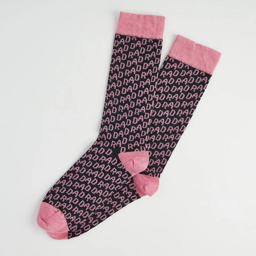 Pair of socks with pink accents on a light gray background