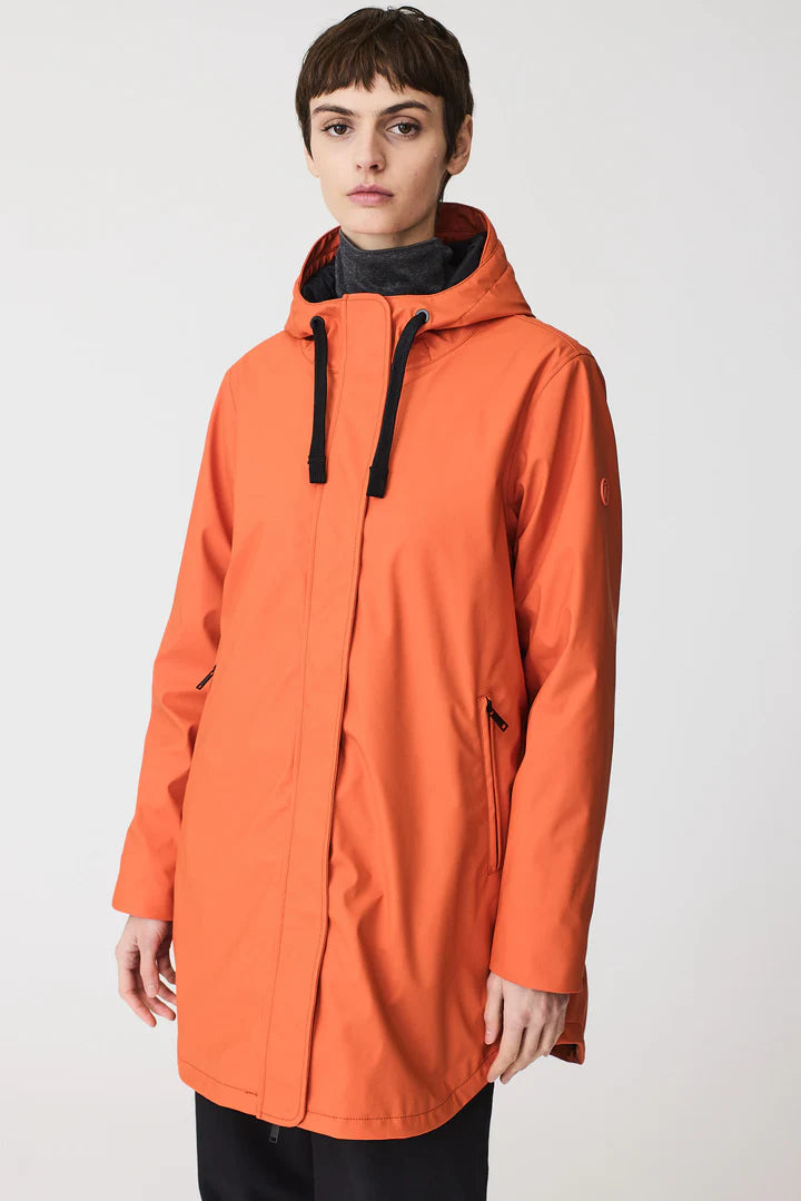 Person wearing an orange raincoat on a white background