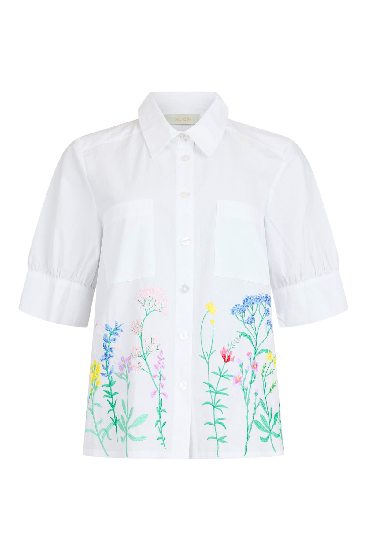 White shirt with floral embroidery on a white background