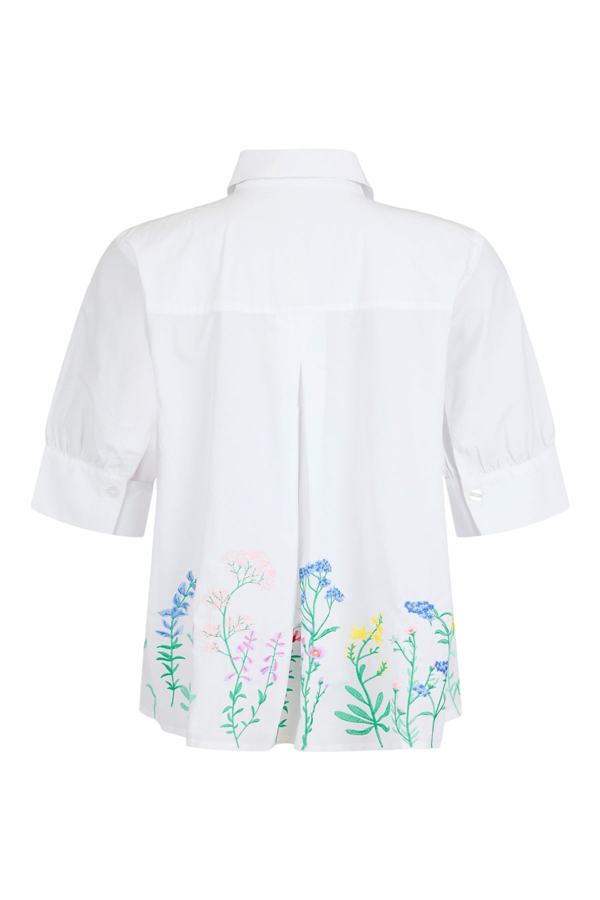 White blouse with floral embroidery on a white background