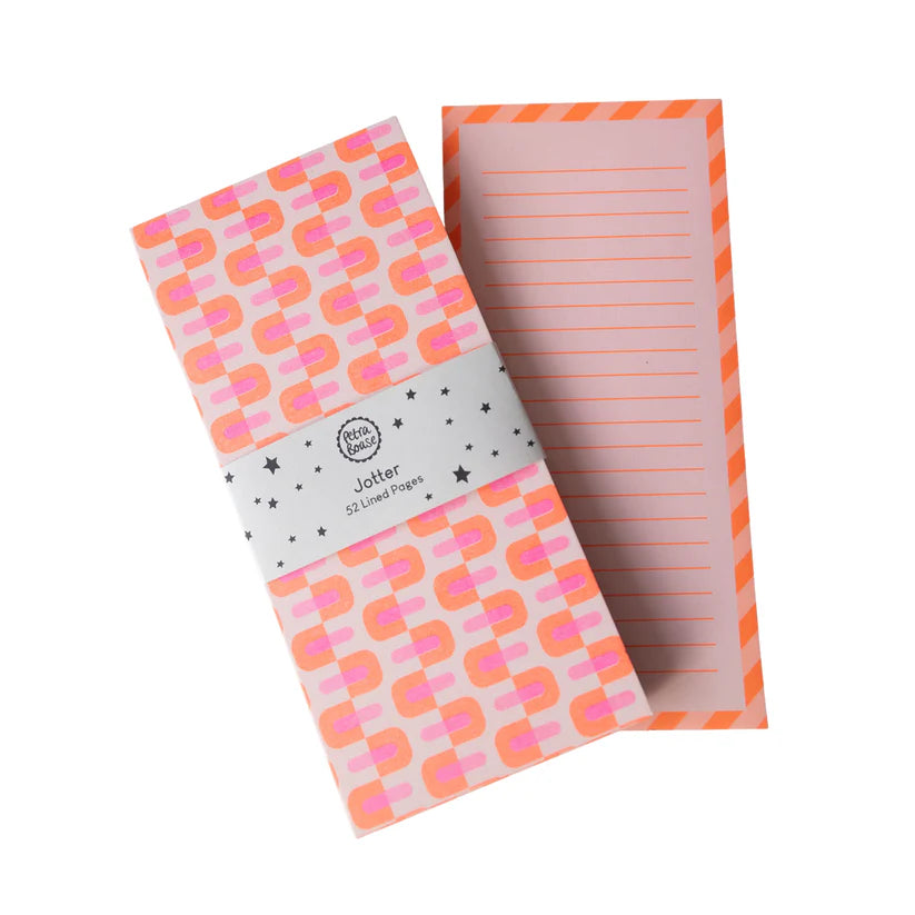 Notebook with geometric pattern and lined pages on a white background