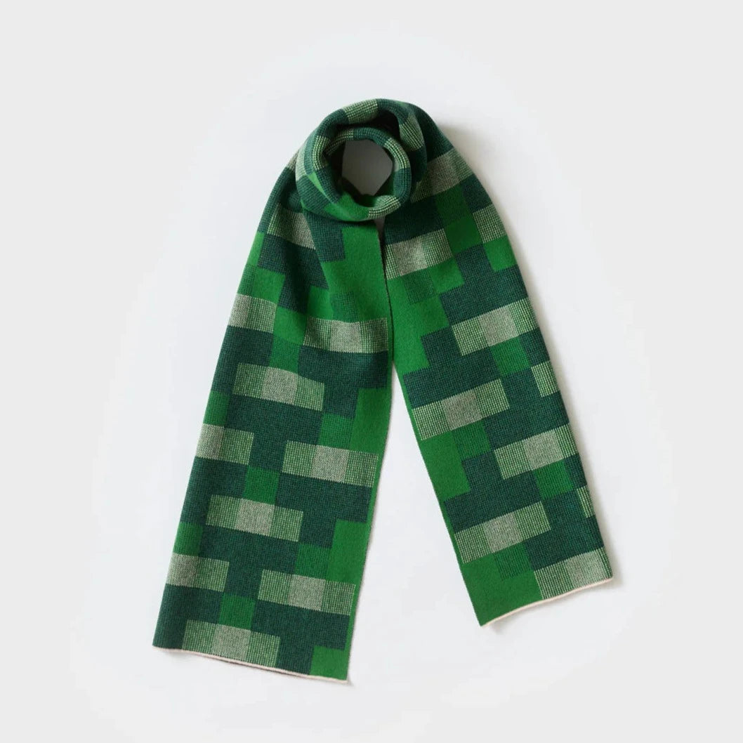 Green knitted scarf with a geometric pixelated pattern.