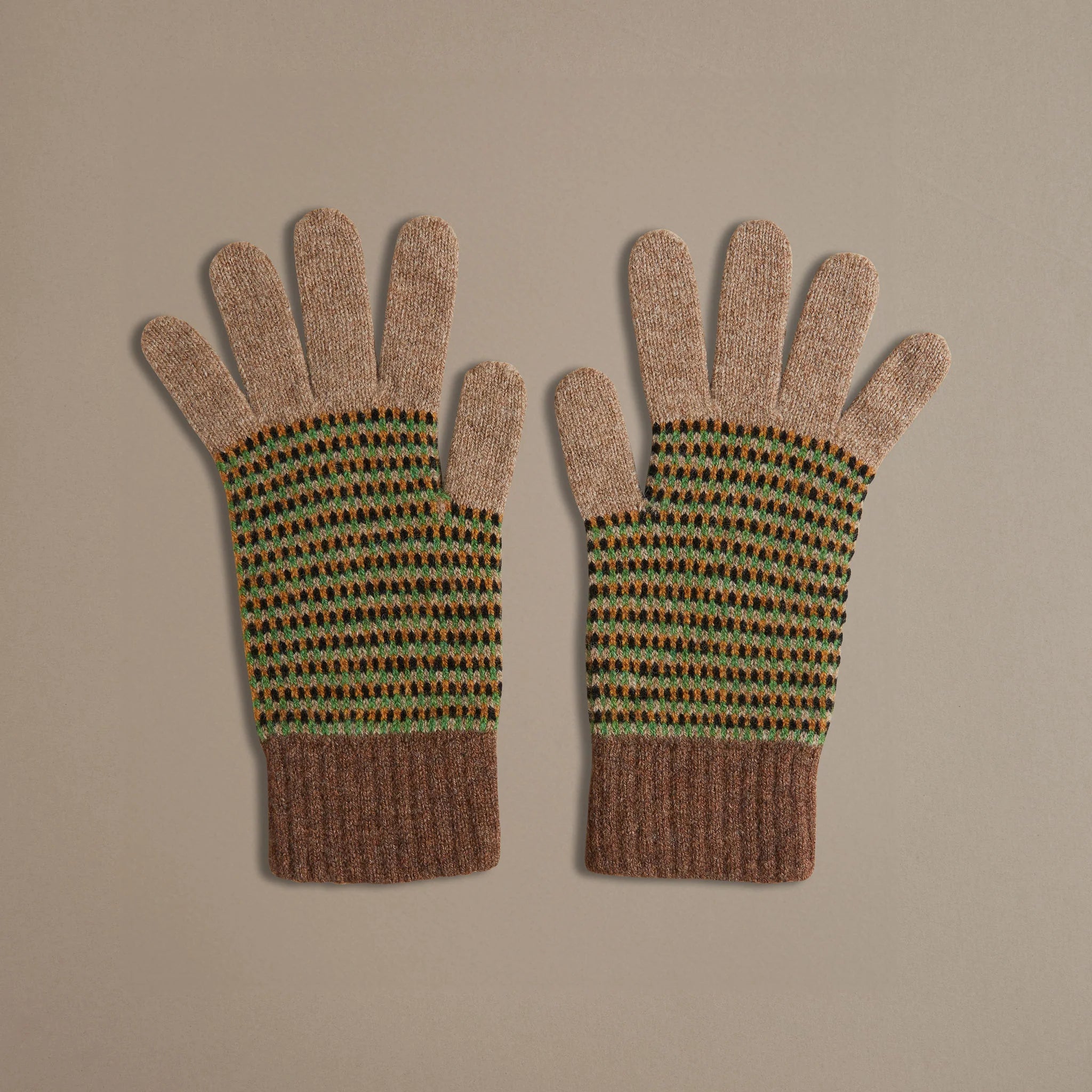 Pair of brown knit gloves with a green, black, and orange geometric pattern.