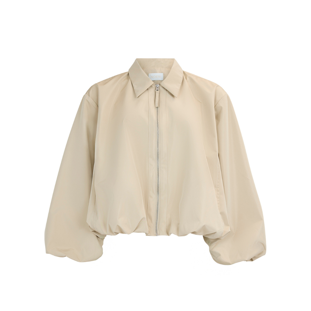 Beige bomber jacket on a white background