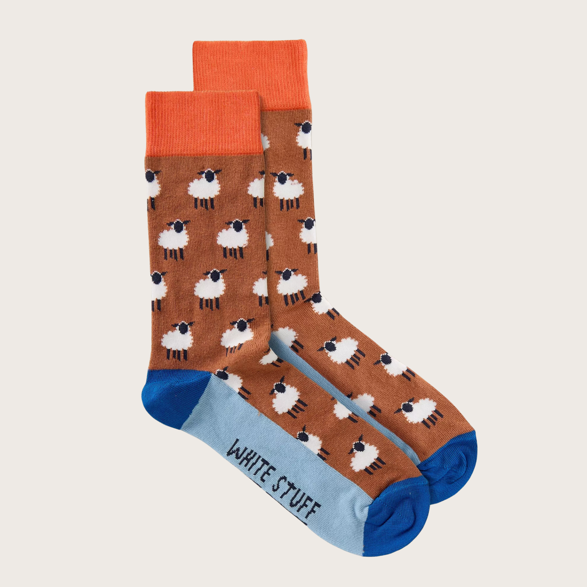 Pair of socks with sheep pattern on a beige background