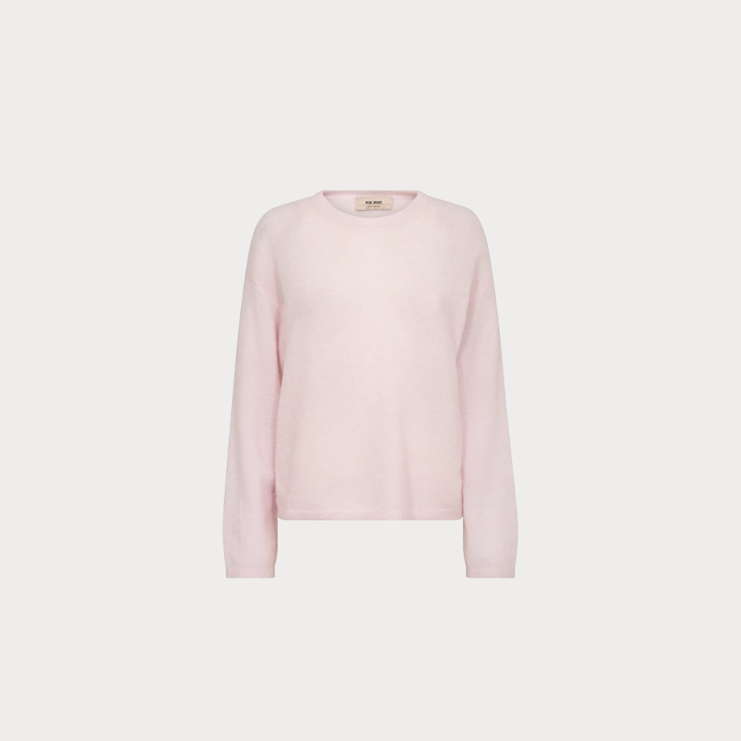 Pink sweater on a light gray background