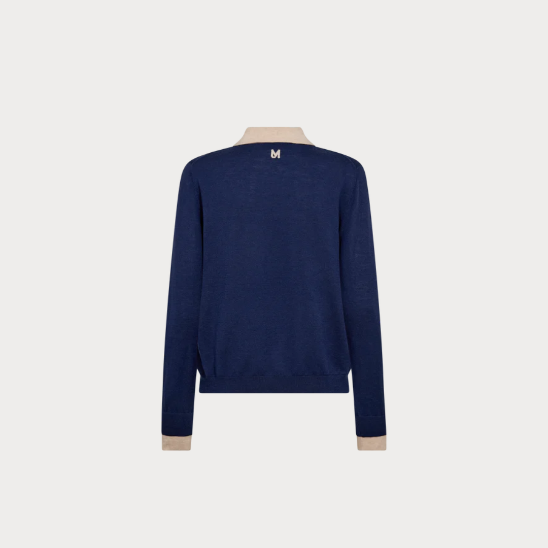 Navy blue sweater on a mannequin with a white background