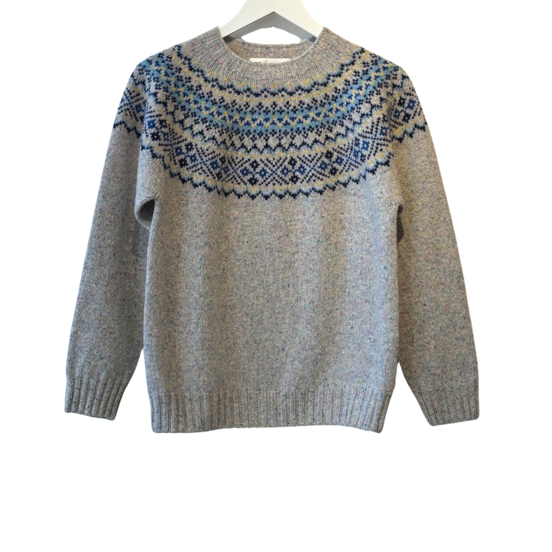 Grey speckled wool sweater with a Fair Isle-style yoke in blue, yellow, and black.