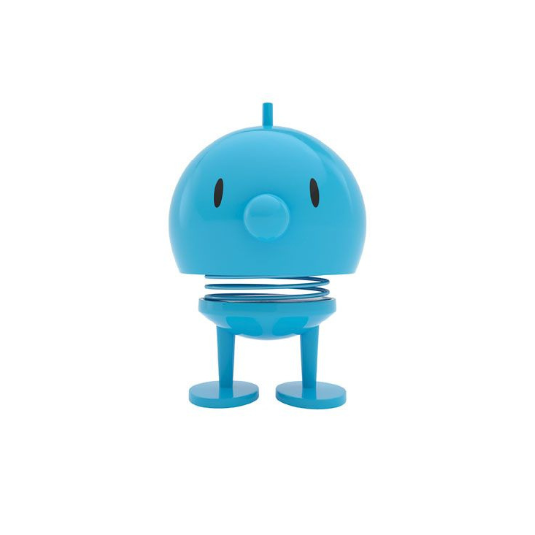 Blue bobblehead toy with a spring and small feet.  Simple cartoon face.