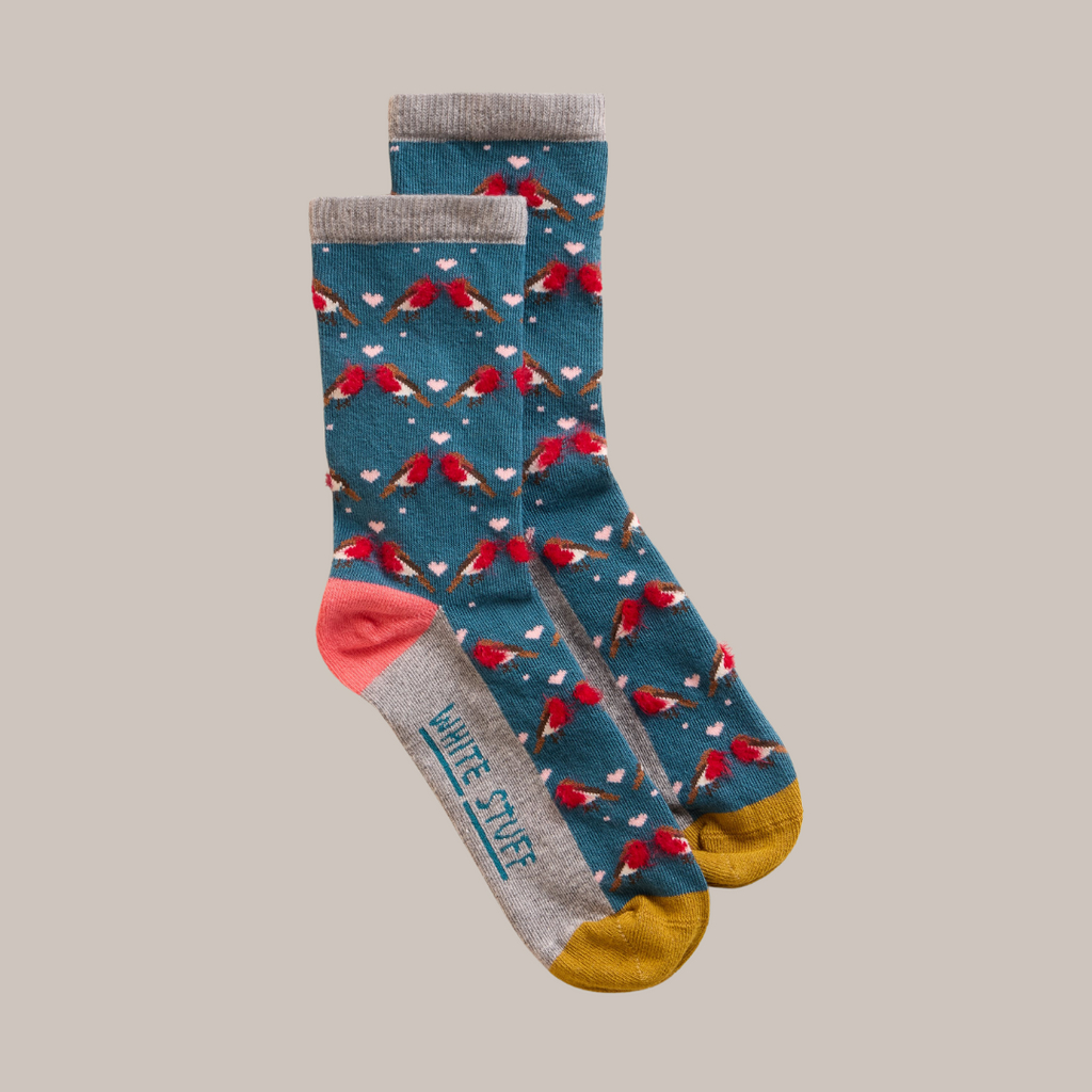 Pair of teal socks with a robin and heart pattern, grey cuffs, and mustard yellow heels.