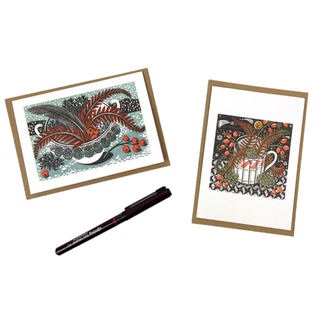 Two greeting cards featuring linocut illustrations of floral arrangements in vintage-style containers.