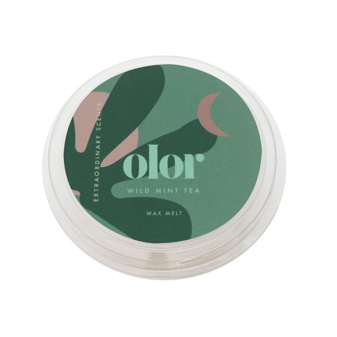 Circular Wild Mint Tea wax melt in clear plastic container.