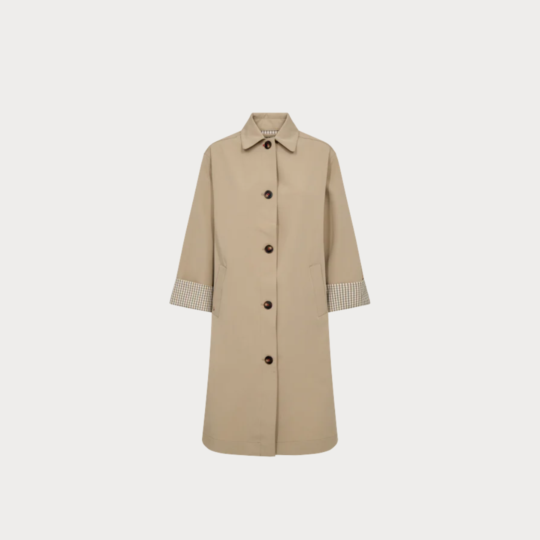 Beige trench coat with button details on a light gray background