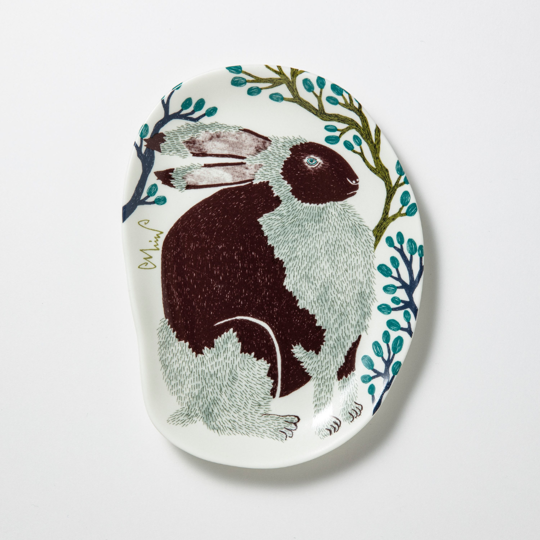 Decorative plate with a rabbit design on a white background