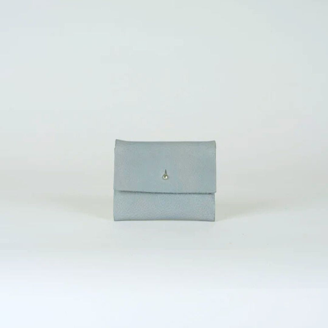 Light gray leather bifold wallet with a small metal stud closure.