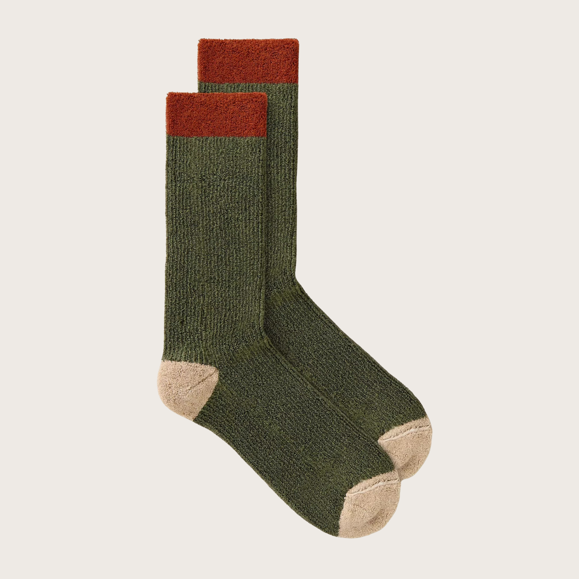 Green socks with red accents on a light gray background