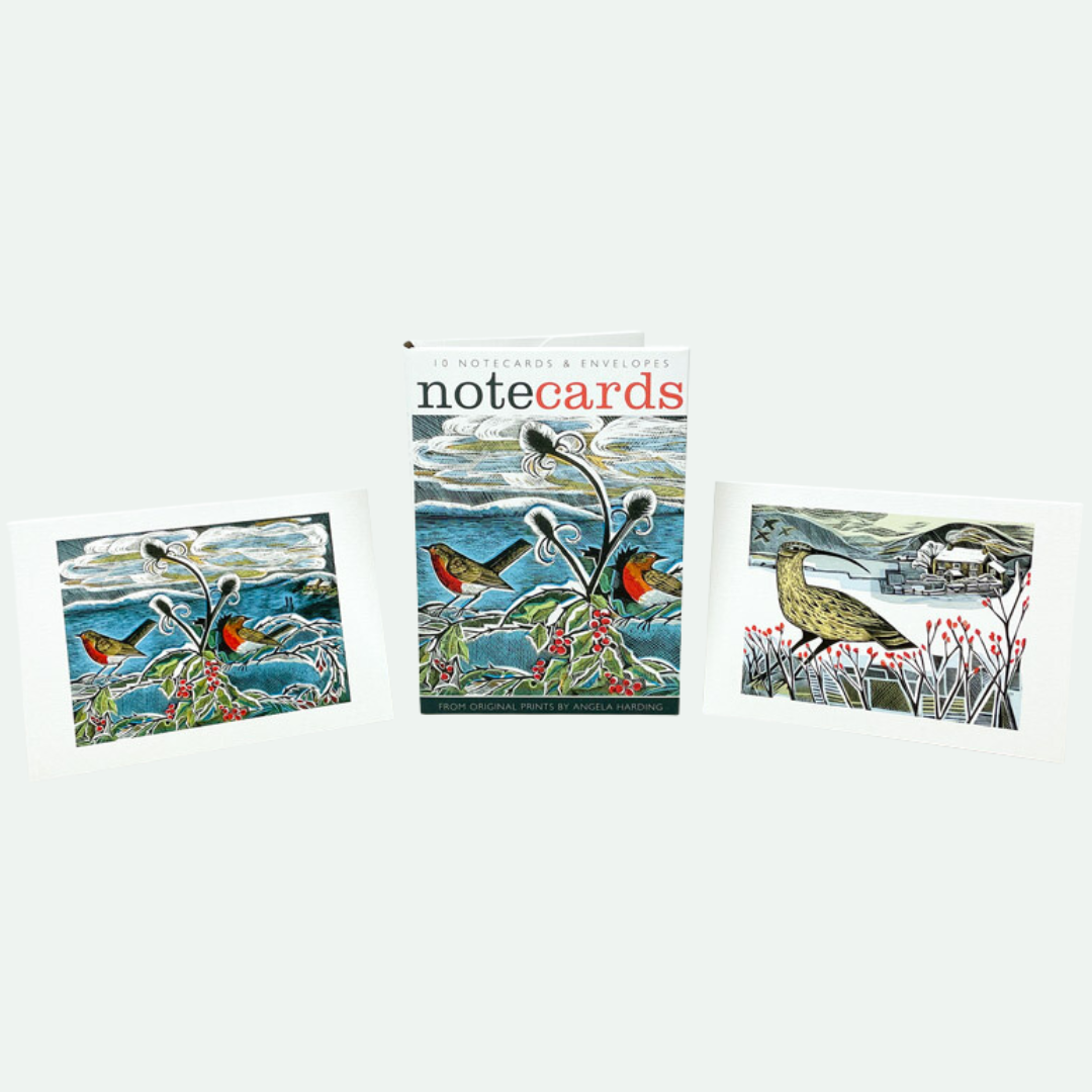 Set of 10 notecards and envelopes featuring linocut prints of robins and a bird in a winter landscape.