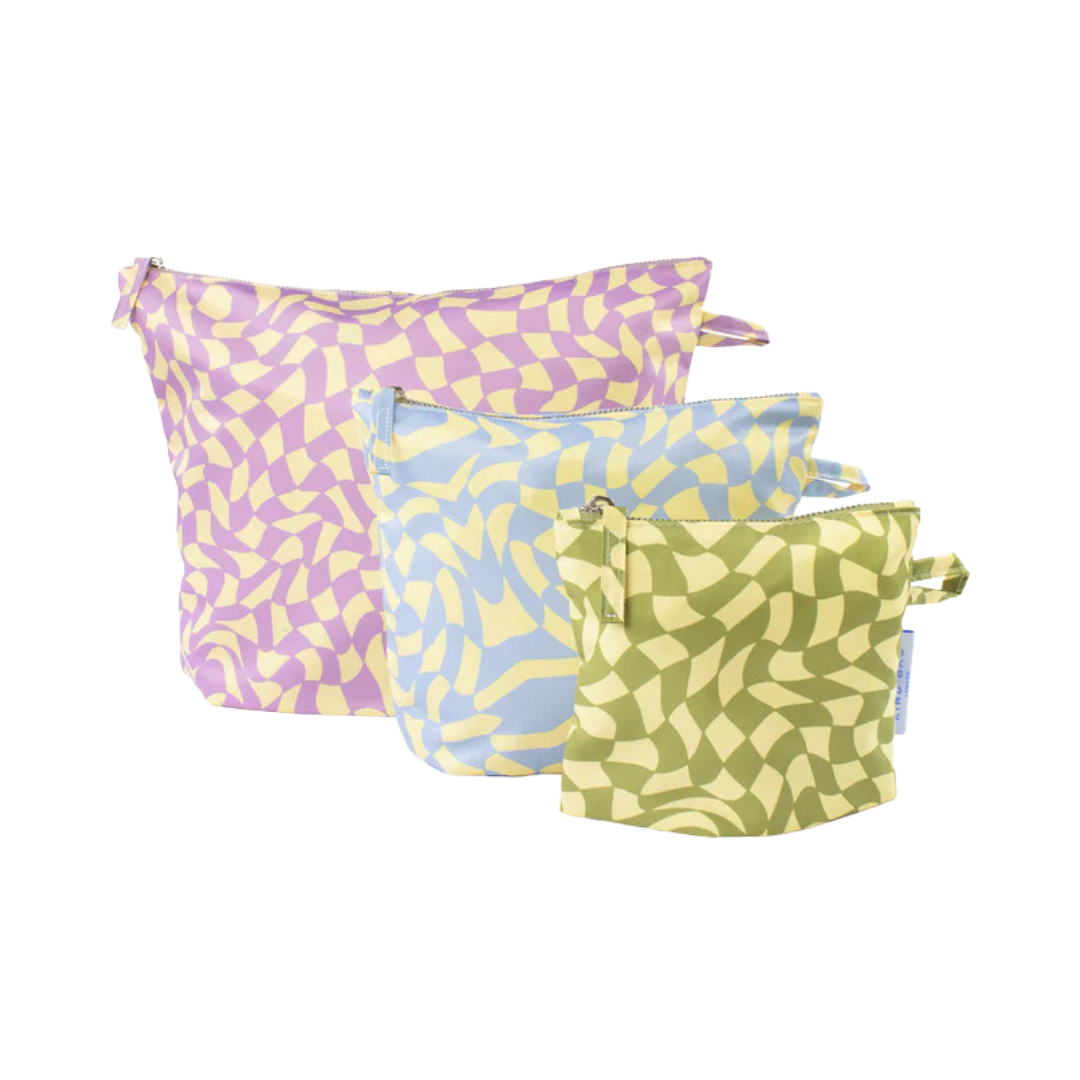 Set of three zippered pouches in pastel purple, blue, and green.  Each features an abstract swirling pattern.