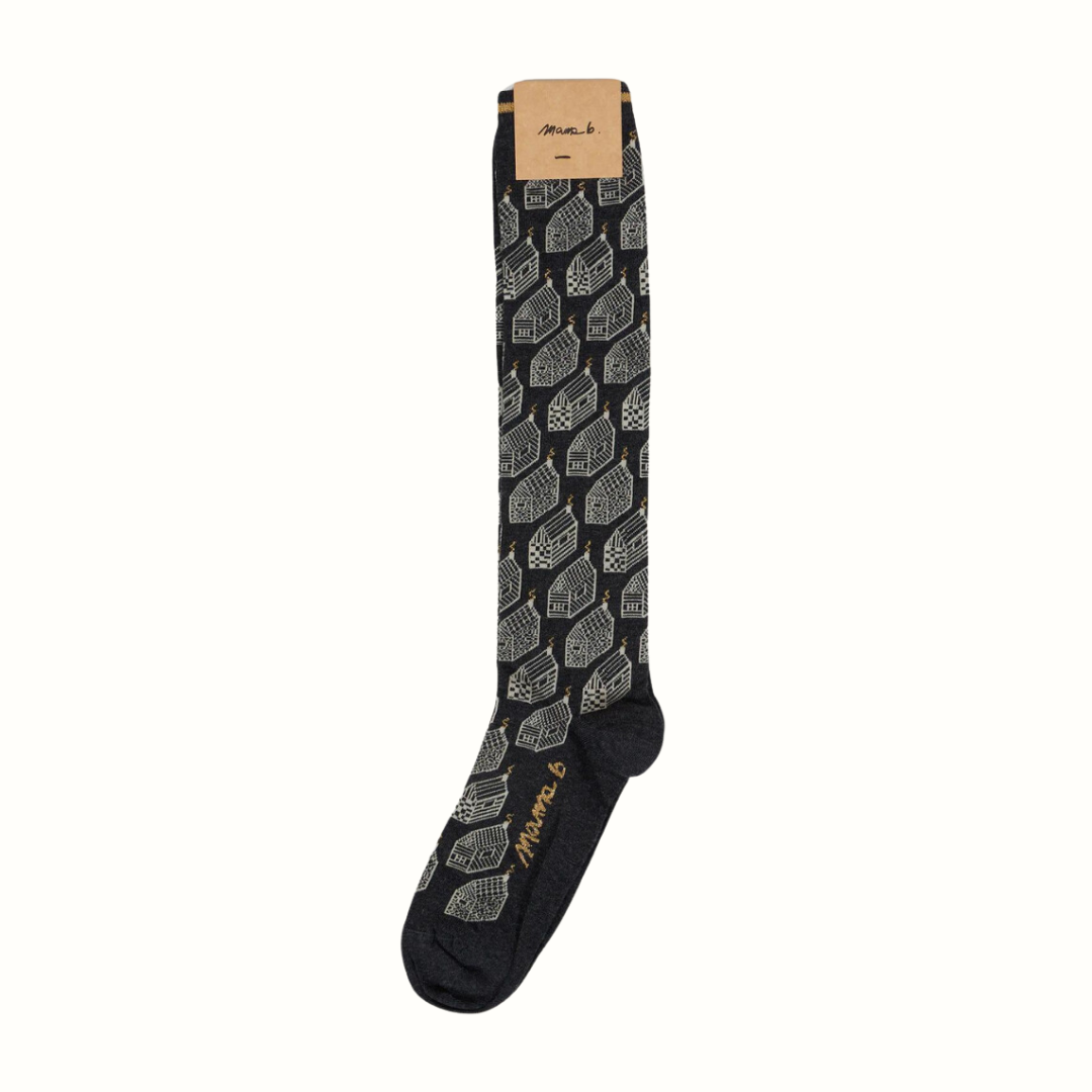 Dark gray knee-high socks with a repeating pattern of light-colored houses.