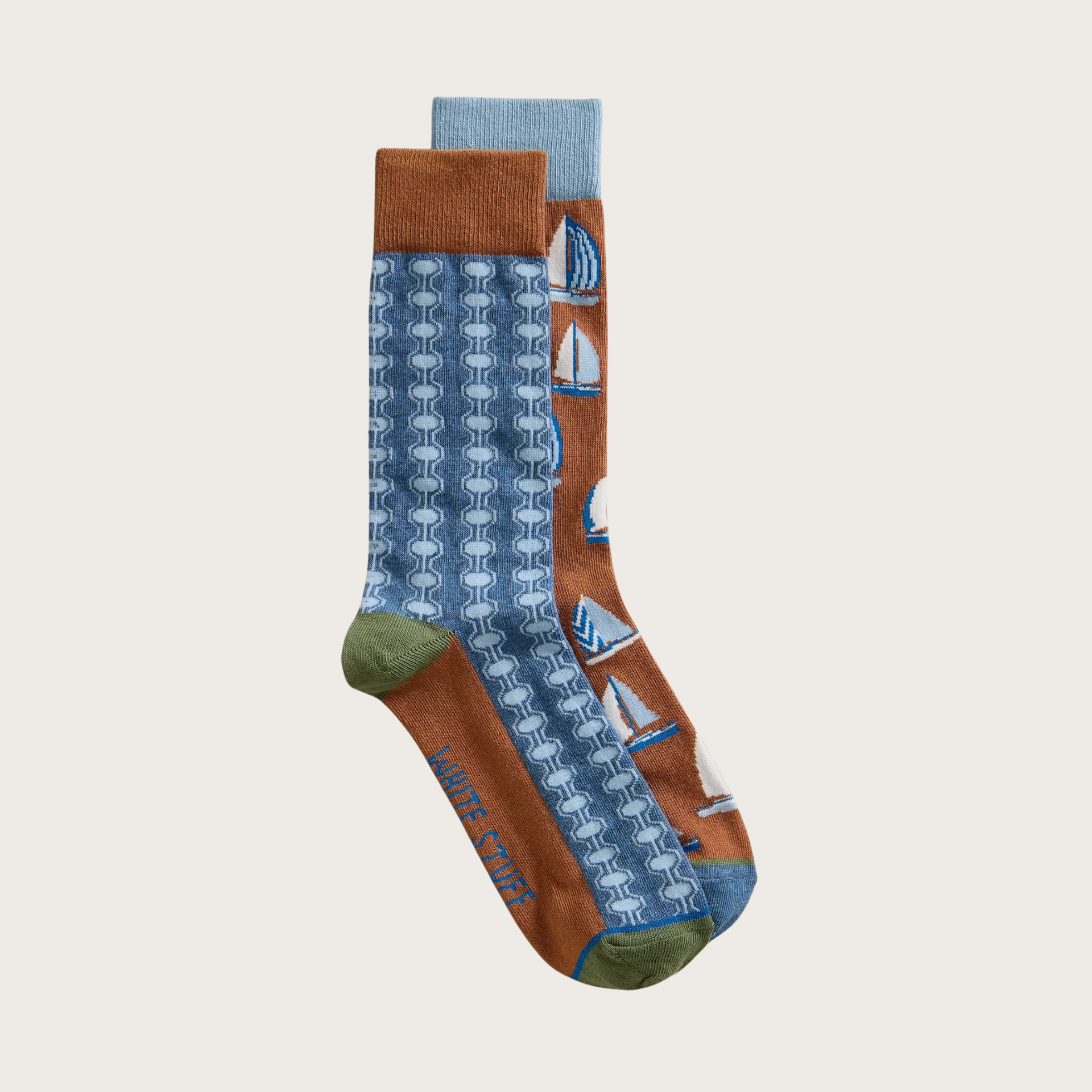 Two pairs of patterned socks on a light beige background