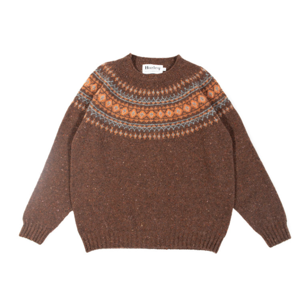 Brown knitted sweater with patterned shoulders on a white background