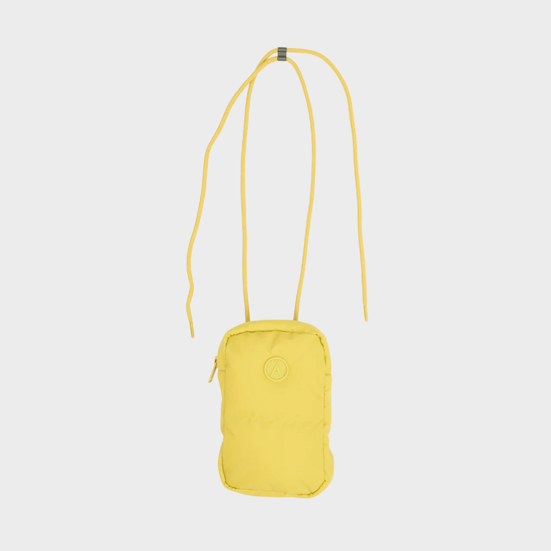 Yellow crossbody bag on a light gray background