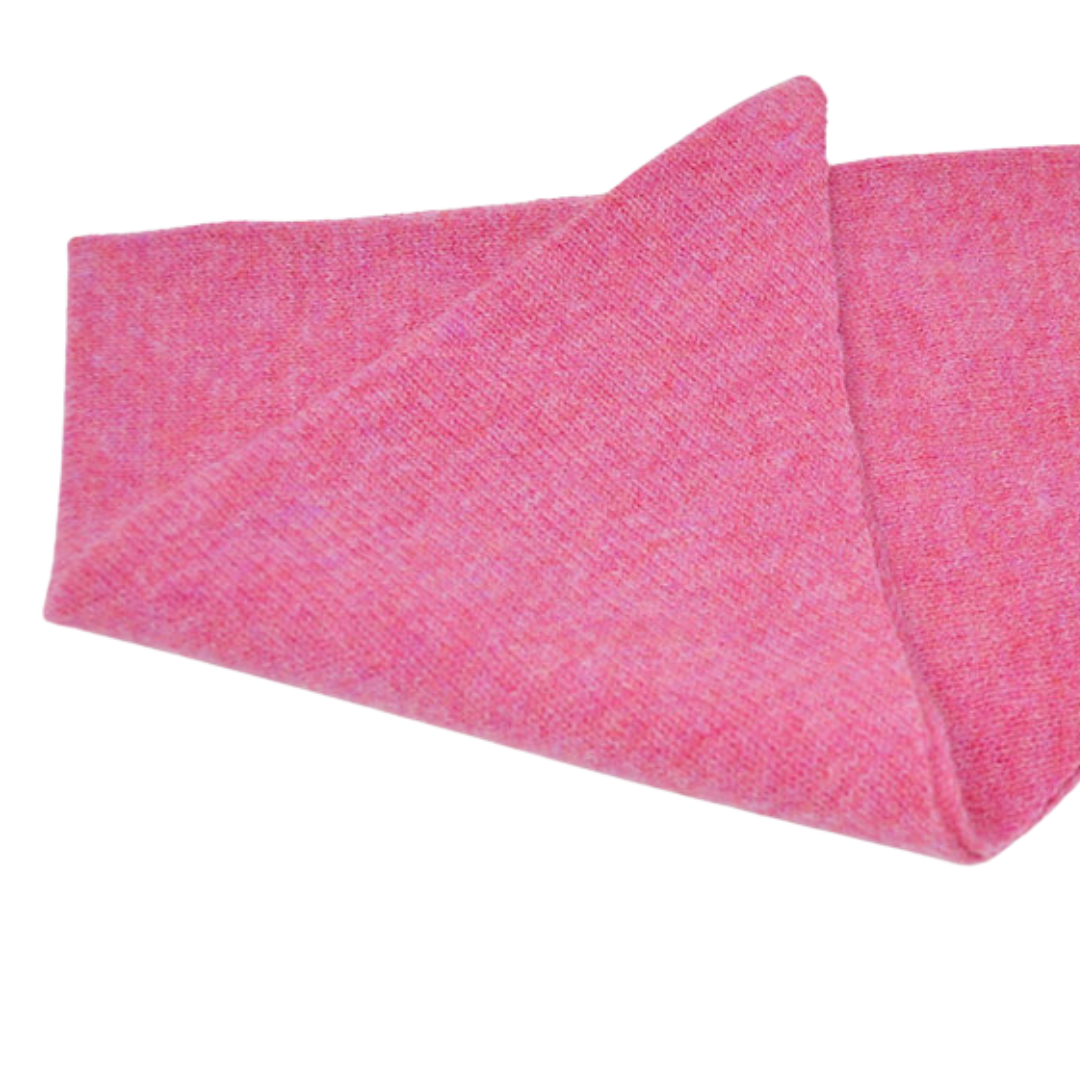 Pink cashmere scarf folded, showing soft texture and subtle heathering.