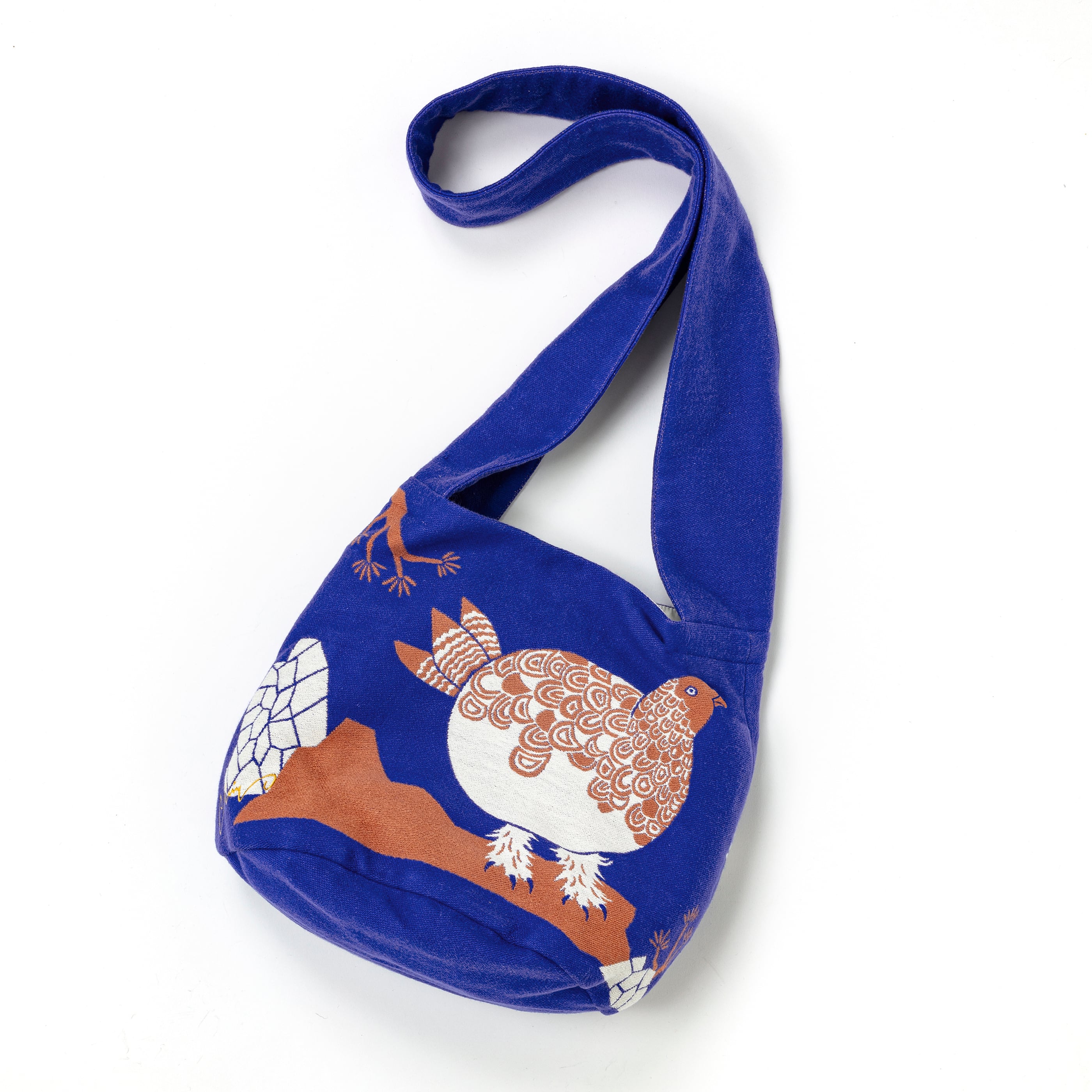Blue bag with a bird design on a white background