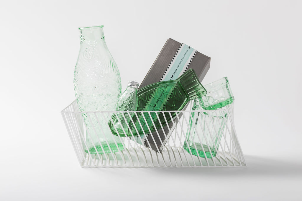 green, pressed glass objects, from the Fish & Fish tableware collection, by Italian designer Paola Navone, for Belgian design brand Serax.