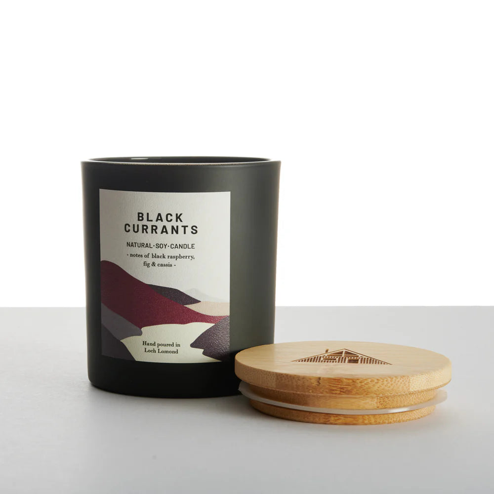 Black Currants natural soy candle in a dark gray jar with a bamboo lid.