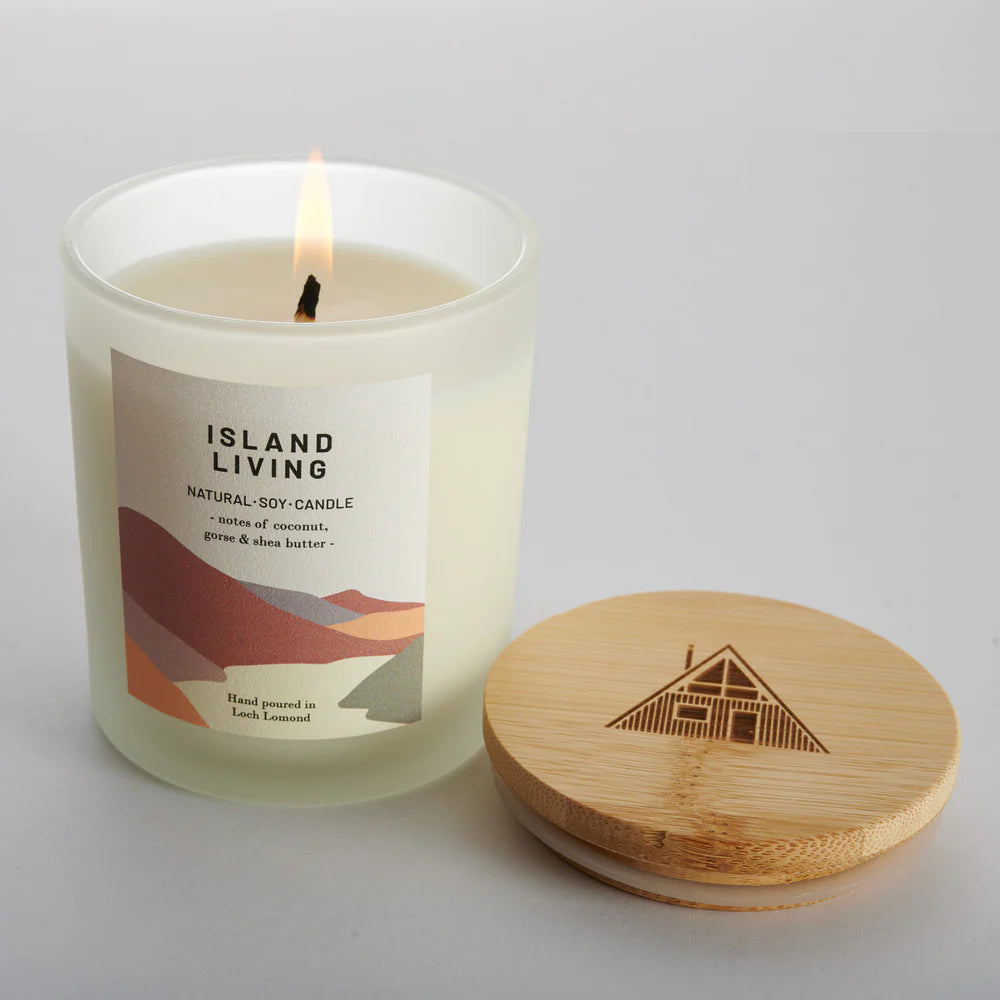 Lit Island Living natural soy candle in frosted glass jar with wooden lid; notes of coconut, gorse & shea butter.
