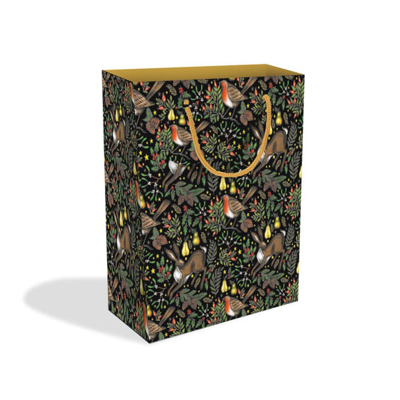 Black gift bag with gold handles, featuring a repeating pattern of robins, hares, and winter foliage.