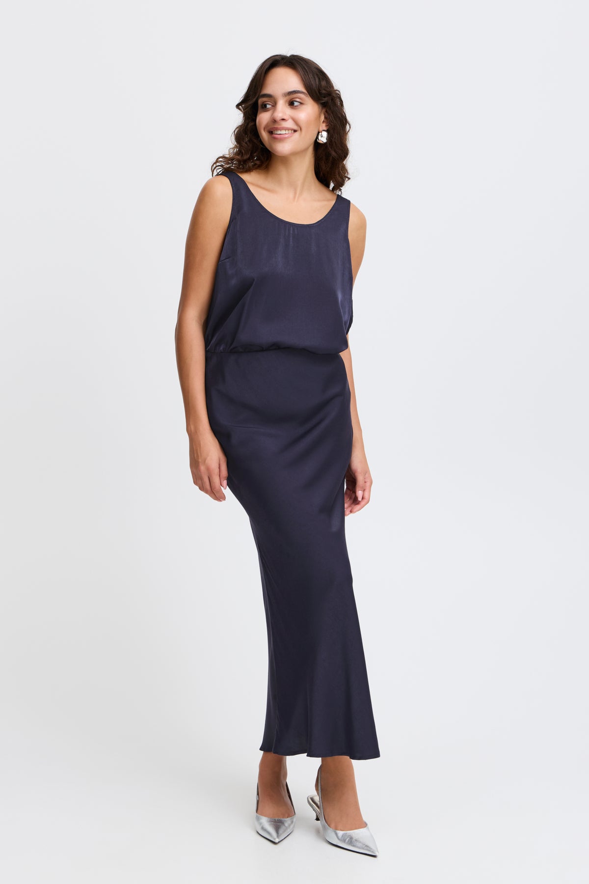 Navy blue bias-cut midi slip skirt and matching camisole top.