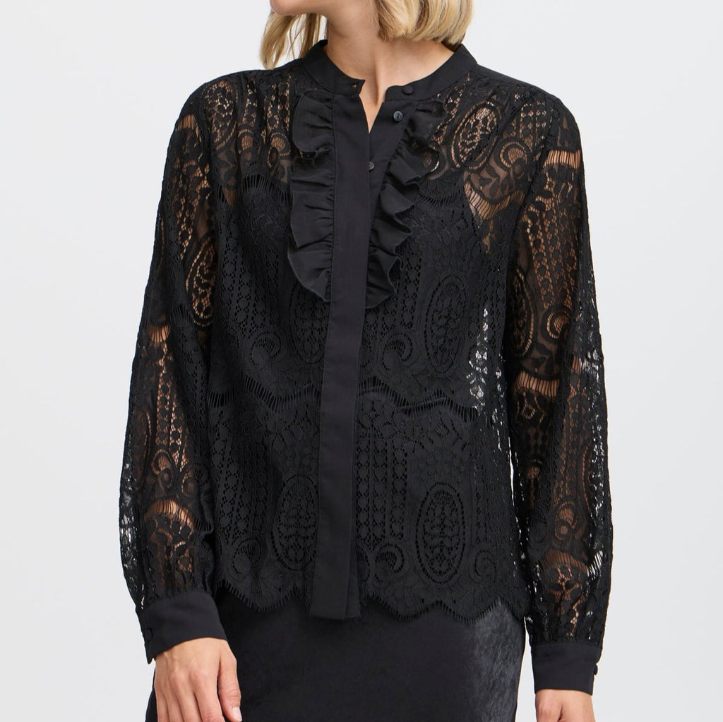 Fransa black lace blouse with ruffles and button detail, featuring long sleeves and a scalloped hem.