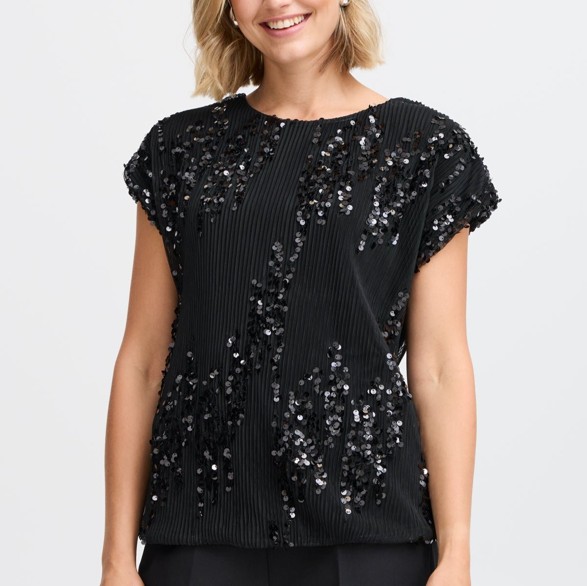 Black pleated sequined top with short sleeves.  The sequins are arranged in a loose, abstract pattern.