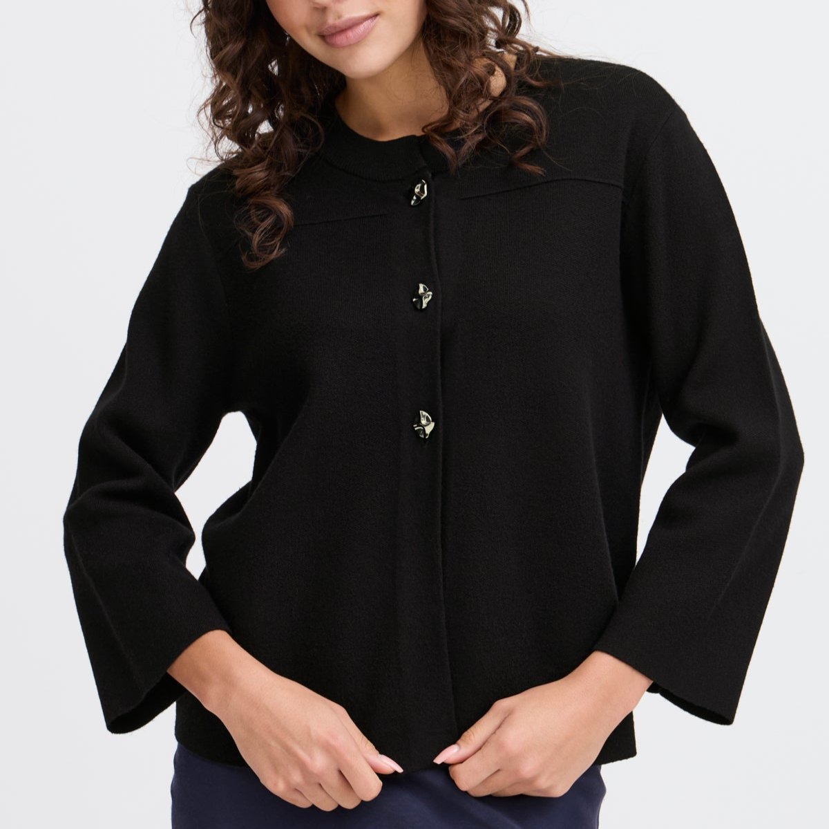 Black button-front cardigan sweater with three-quarter sleeves and subtle decorative buttons.