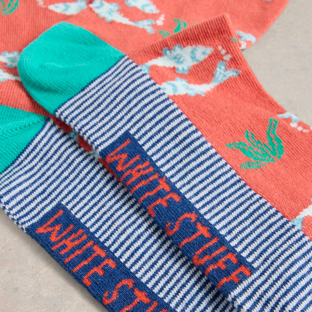 Pair of colorful striped socks with "White Stuff" logo. Features teal, navy, white stripes and coral accents.
