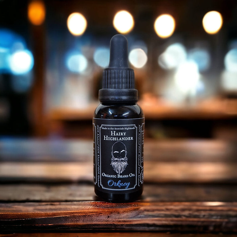 Dark glass bottle of Hairy Highlander Orkney organic beard oil with a black dropper top.