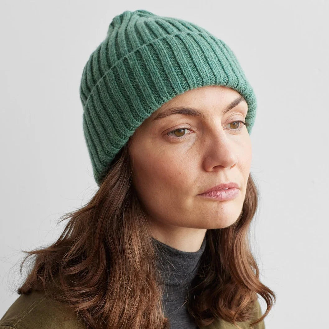 Sage green ribbed knit beanie.