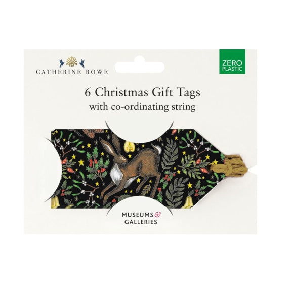 Six Christmas gift tags with coordinating string. Black background features a hare and festive foliage design.