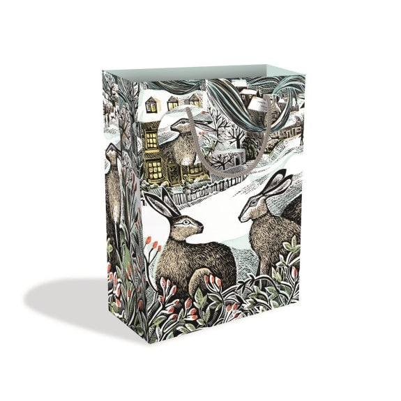 Gift bag featuring a winter scene with hares and a village house, illustrated in a vintage style.