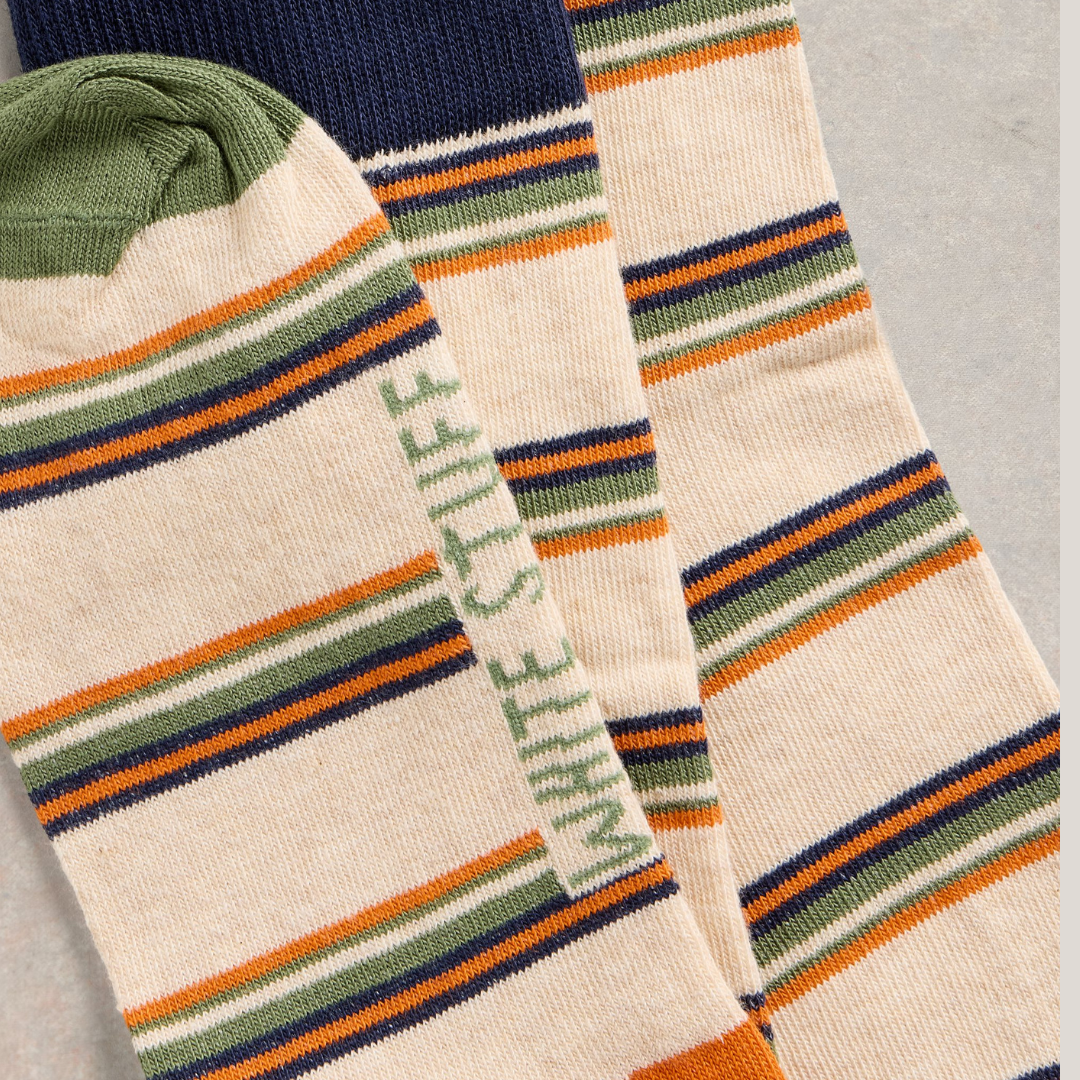 Cream-colored striped socks with orange, green, and navy blue stripes.