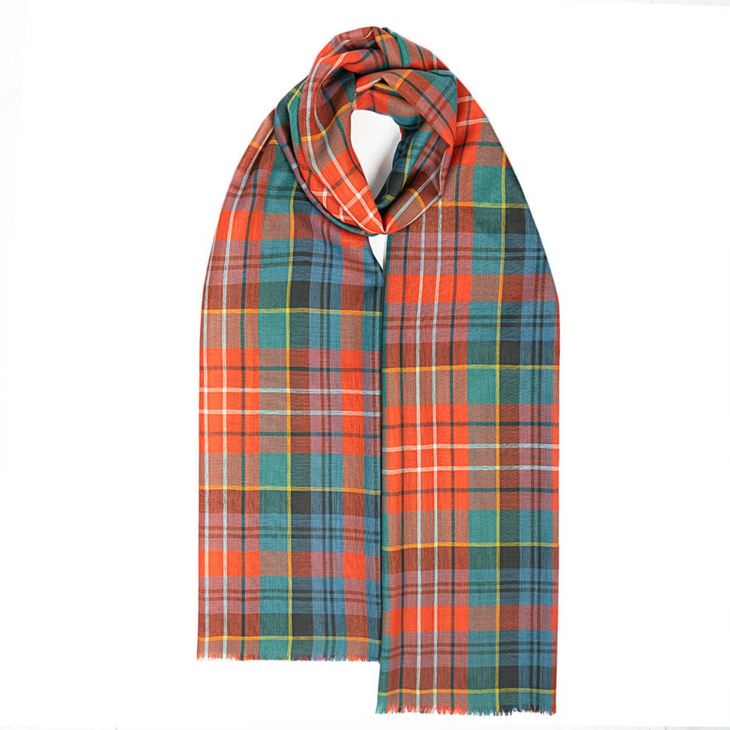 A long, rectangular scarf in a vibrant orange, teal, and dark green plaid pattern.