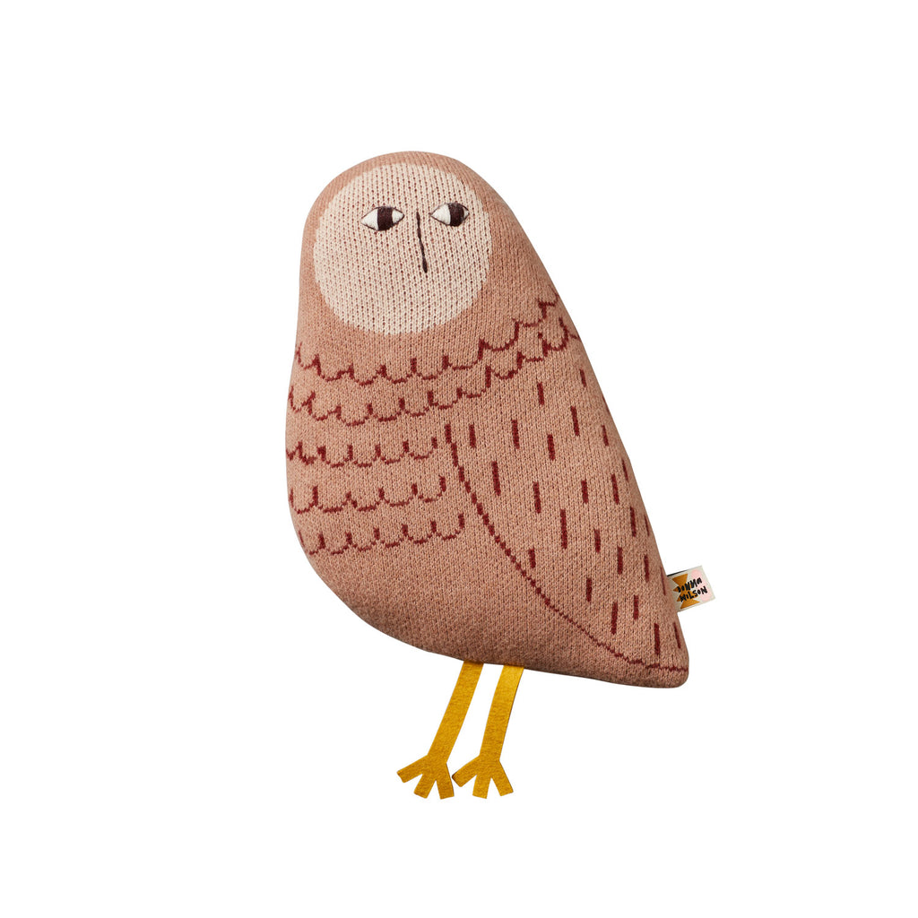 Stuffed owl pillow by Donna Wilson, featuring a beige body, maroon details, and yellow feet.