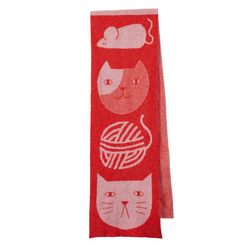 Red scarf by Donna Wilson featuring pink cat and mouse illustrations, with a yarn ball design.